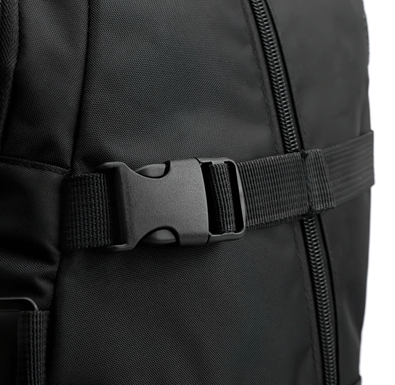 Close-up of black sports backpack with adjustable strap and zipper, highlighting durable design and functionality.